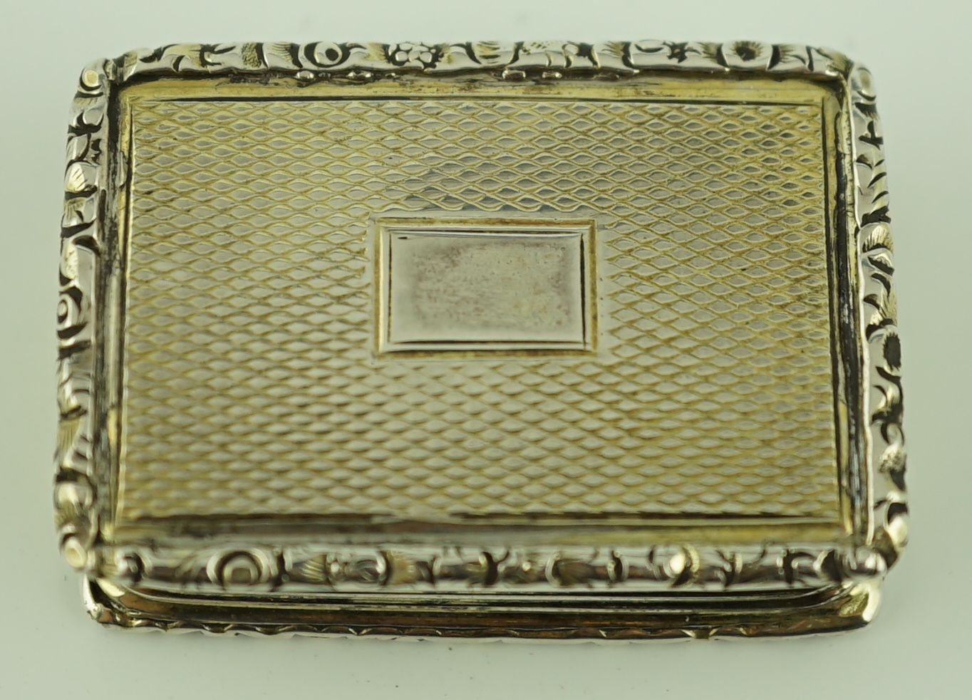 A William IV engine turned silver gilt rectangular vinaigrette, by Joseph Wilmore